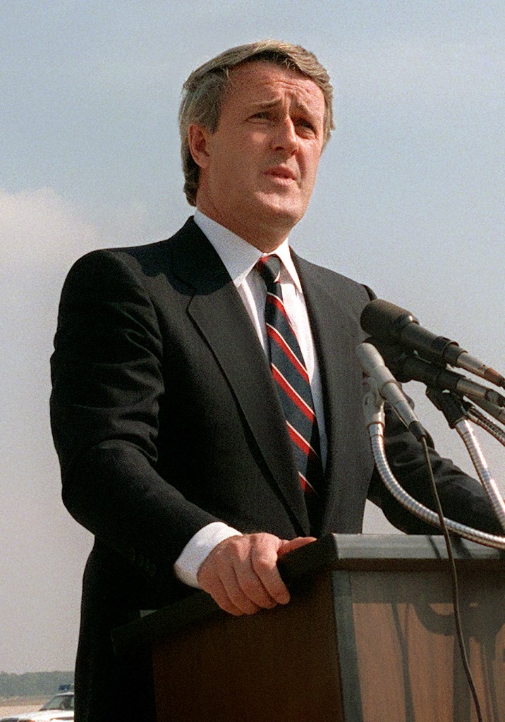 Photo of a young Prime Minister Brian Mulroney at an outdoor  podium in the 1980s. 